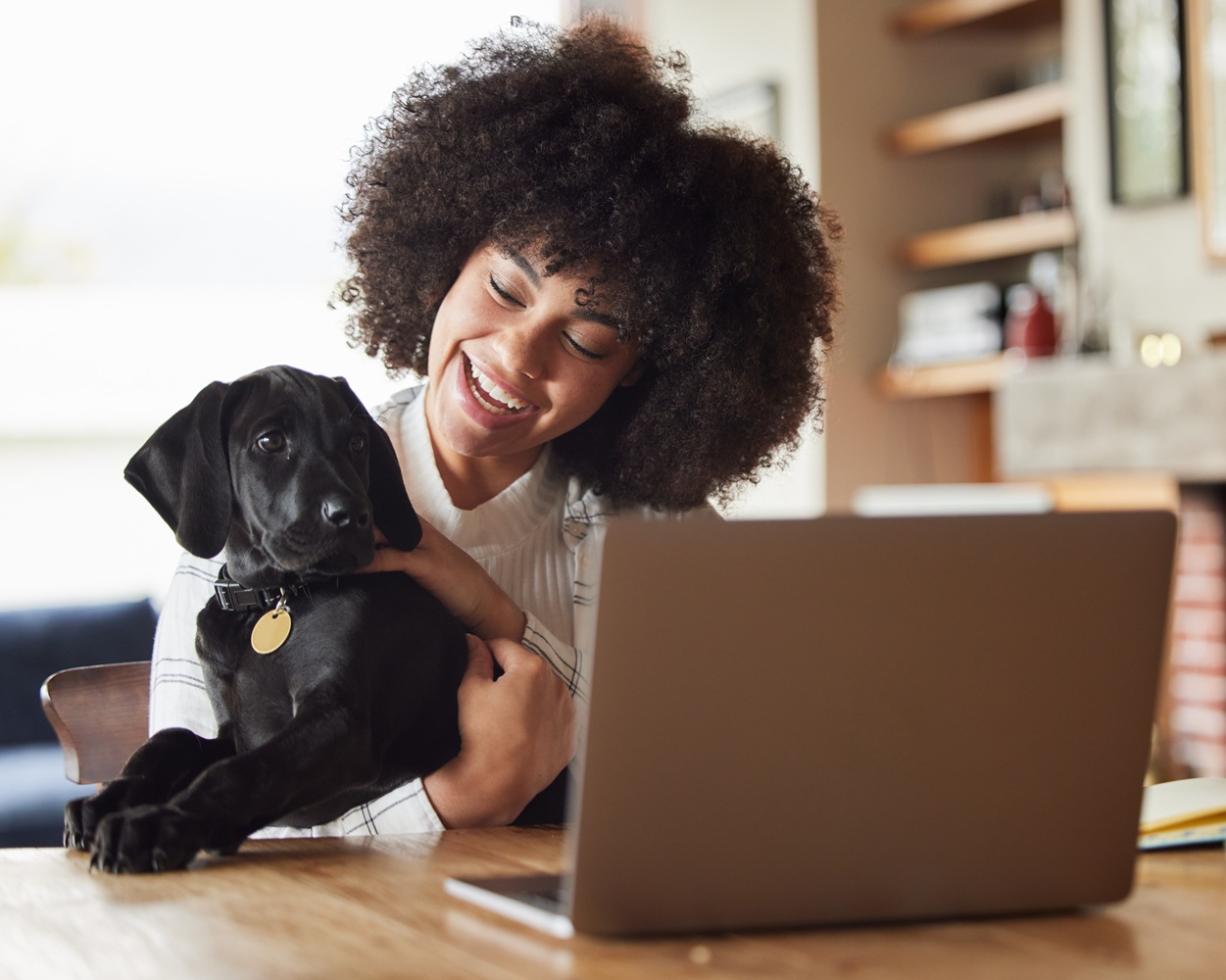 Student studying at home with dog